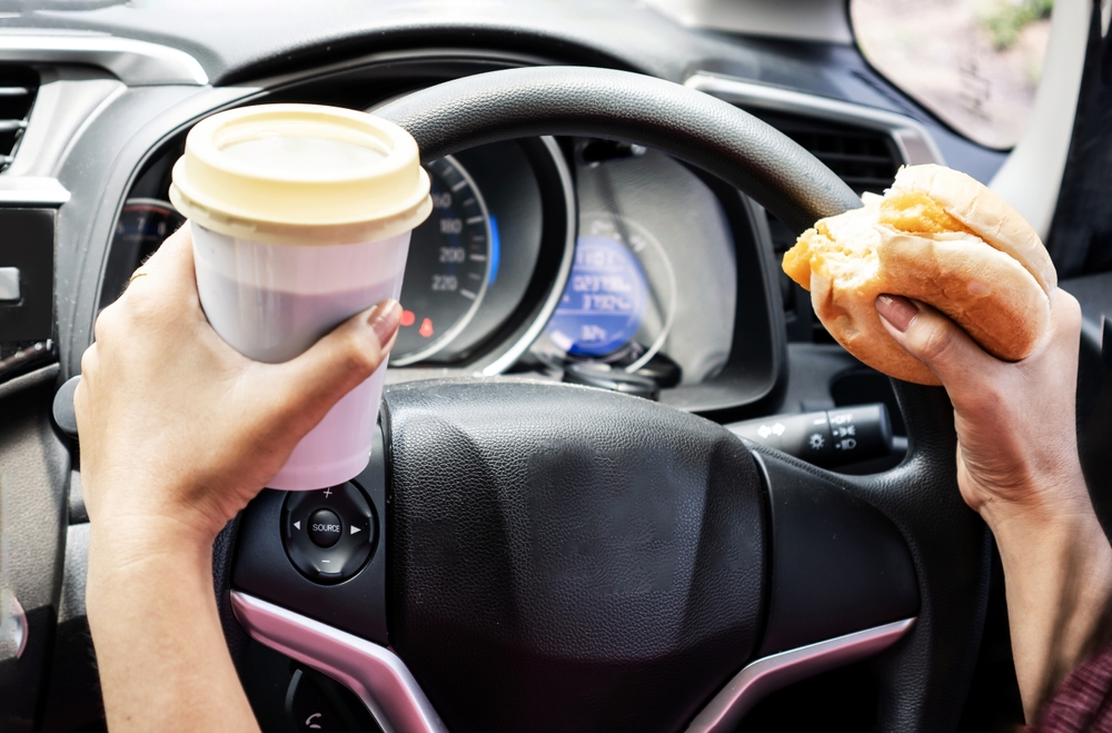 Photo of a Driver Eating While Driving